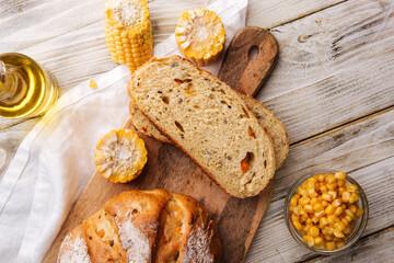 Sliced fresh baked corn and pumpkin bread on the decorated table