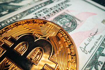 Bitcoin on american dollar banknote close up