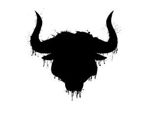 Black silhouette of a bull head with horns with paint splashes, splatters and blots isolated on a white background.