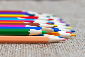 Fototapeta premium Set of colorful pencils on burlap.