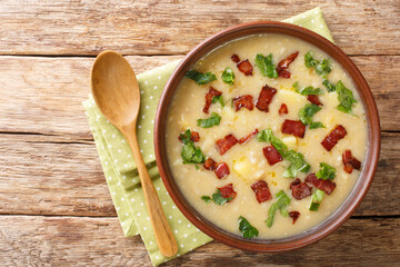 Rumfordsuppe pea and barley soup with bacon close-up in a plate on the table. horizontal top view from above