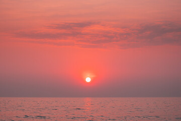 Sundown Above Sea Horizon At Sunset. Natural Sunrise Sky Warm Colors Over Ocean. Sun Over Sea Waters