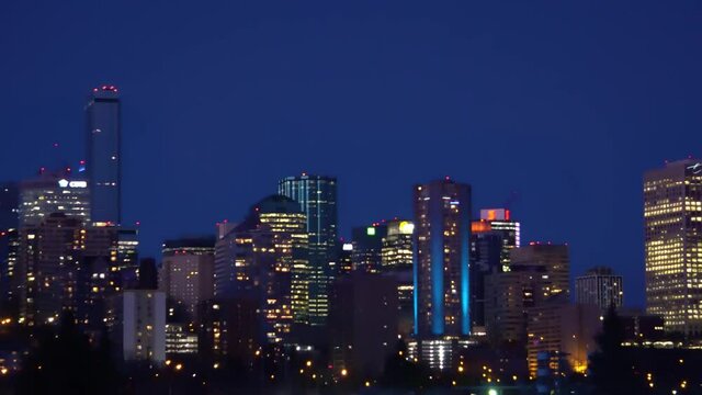 Evening offices hotel sklyline downtown Edmonton capital city Canada Alberta as building lights cars less traffic during the quiet bokeh blur of skyscrappers in dark navy blue horizon nite fall LED's