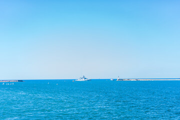 Coastline and waves in the sea, sunny Crimean summer. Horizontal orientation