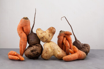 Ugly vegetables, side view, close-up. Concept - Food organic waste reduction. Using in cooking...