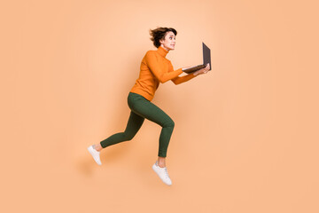 Full size profile side photo of young unhappy upset sad attractive girl running typing in laptop...