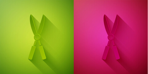 Paper cut Gardening handmade scissors for trimming icon isolated on green and pink background. Pruning shears with wooden handles. Paper art style. Vector Illustration.