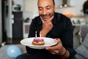 40 years old man celebrating his birthday at home