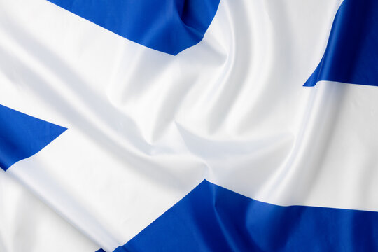 Folded national flag of Scotland, fabric background