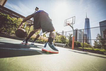 Two street basketball players playing hard on the court