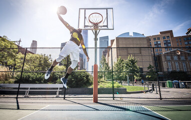 Basketball player making huge slam dunk