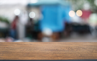 Empty wooden table in front of abstract blurred background of coffee shop . can be used for display or montage your products.Mock up for display of product