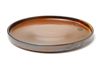 Empty earthenware plate on white background