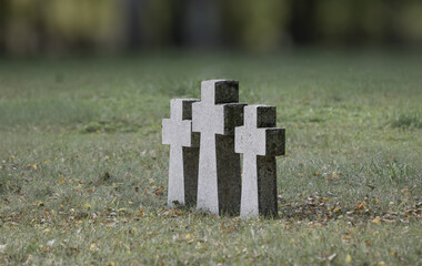 Three granite crosses erected in Europe at burial sites.