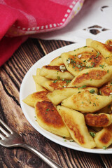 Polish dish kopytka served at the table