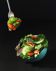 A levitating bowl with vegetable salad