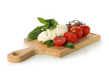 Board with mozzarella cheese, tomato and basil isolated on white background