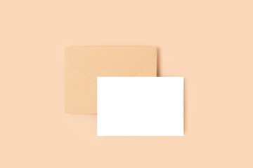 Envelope and blank paper sheet mockup. Letter template on a beige background.