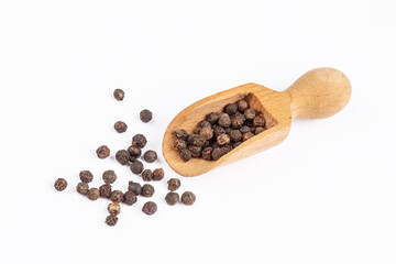 Dried black pepper on the white background