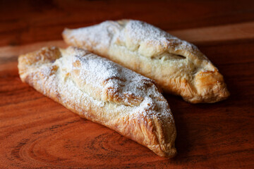 Homemade nutella croissants on a rustic wooden board