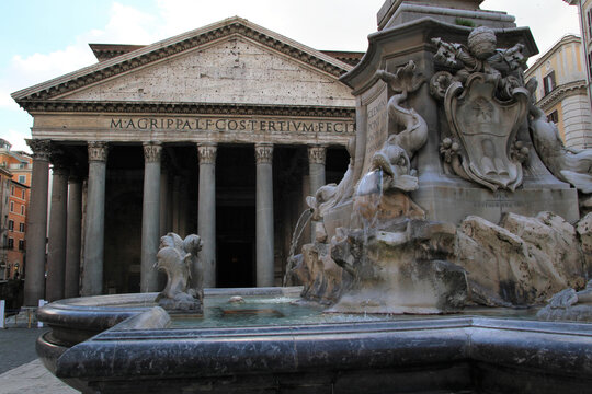 External view of the Panthon in Rome and fountain in the foreground by Della Porta.