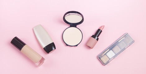 Obraz premium Beautiful cosmetic accessories on a pink background.