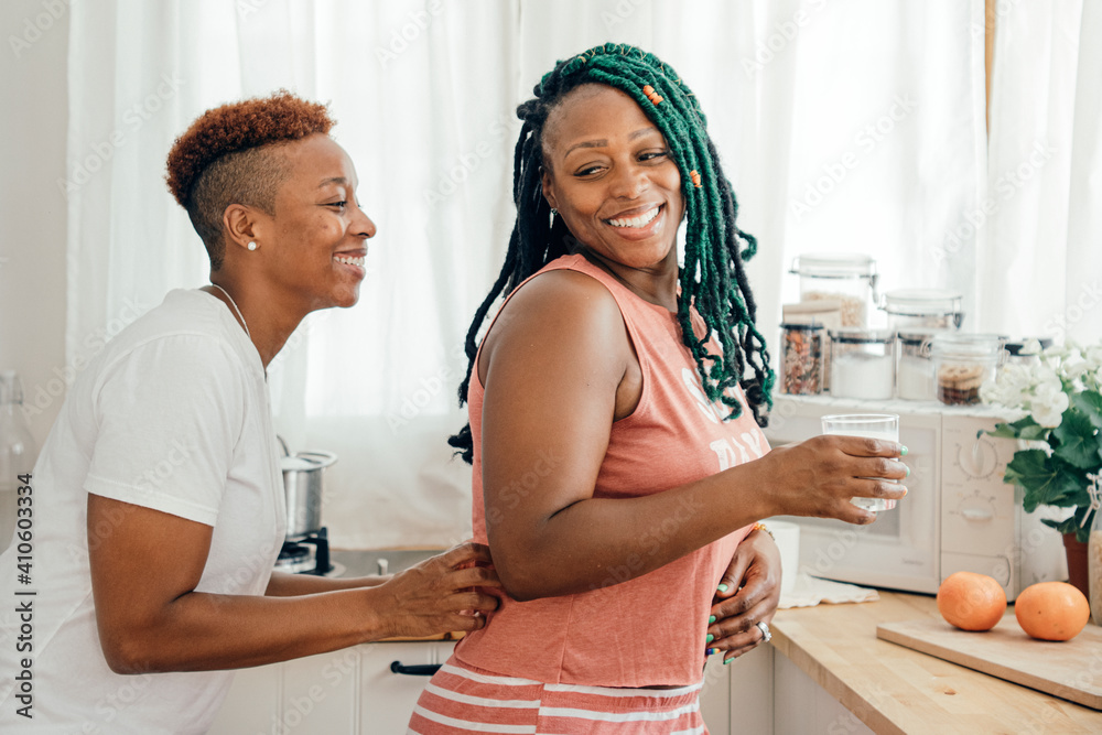 Sticker happy gay couple in the kitchen