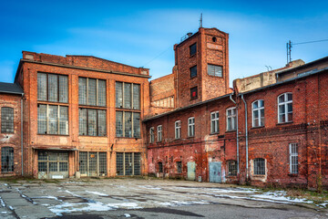 Obraz premium Ruins of a brick sugar factory in Pruszcz Gdański in winter, Poland