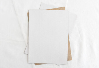 Fashionable stock stationery background - white card for writing on a white table. Wedding feminine...