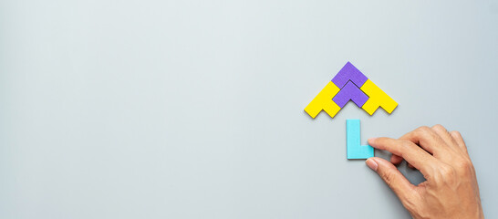Umbrella shape block of colorful wood puzzle piece on gray background. logical thinking, business...