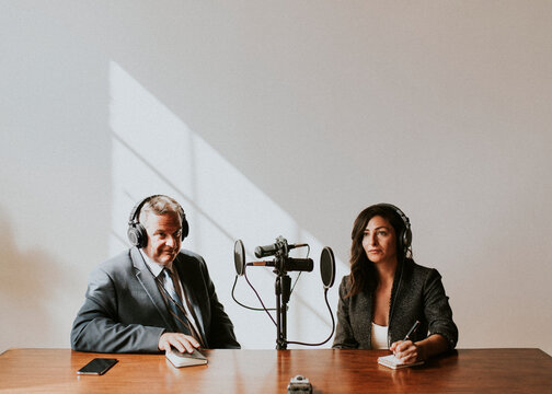 Female Broadcaster Interviewing Her Guest In A Studio