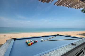 Blue Pool table and balls with sea view