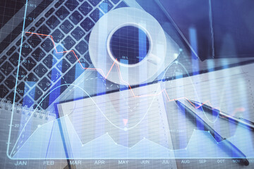 Stock market chart and top view computer on the table background. Double exposure. Concept of financial analysis.