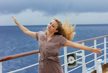 Young woman on the open deck. Girl on a cruise ship