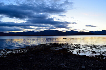 colourful sky, mountain and fjord as the sun is going down for the night