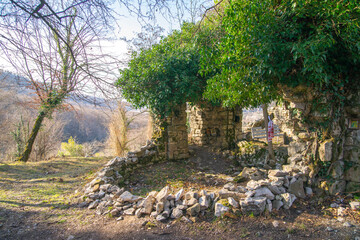 The ruins of the Church of St. Nicholas the Wonderworker in the village of Akhshtyr, Sochi, Russia. Archaic Orthodox building.