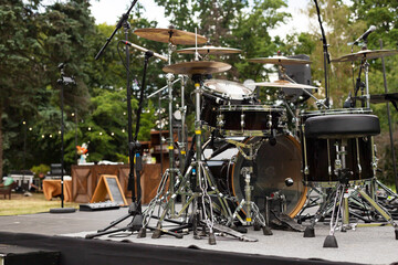 Fototapeta na wymiar Outdoor drum kit. Live music concert in the park. 