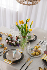 Beautiful Easter table setting with festive decor indoors