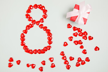 March 8, composition of hearts on a blue background. View from above.