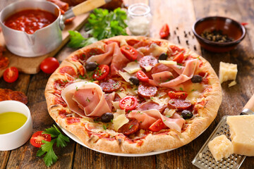 pizza with prosciutto ham,  cheese and tomato