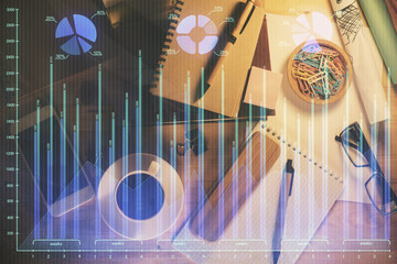 Double exposure of forex graph drawing and work table top veiw. Concept of financial analysis.