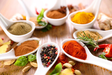 various spices on wood background