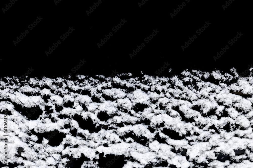 Poster white snow isolated on a black background. winter elements for design
