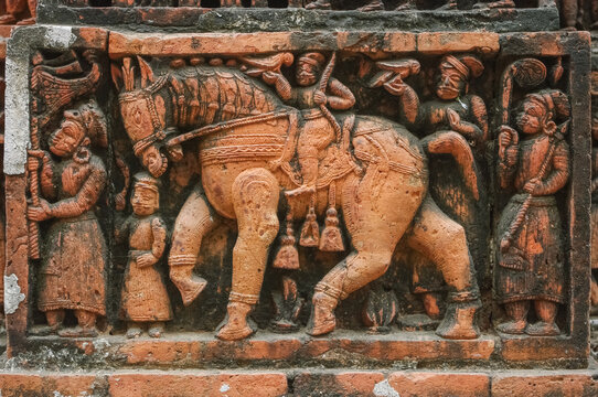 Men and horse going hunting with birds: intricate terracotta carving at Kantaji aka Kantajew medieval hindu temple in Kantanagar, Dinajpur district, Bangladesh