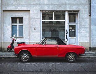 old red car in the street