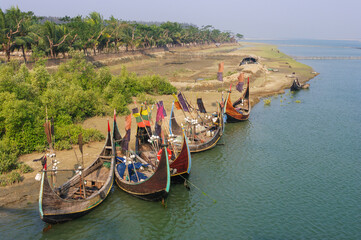 Group of beautiful traditional wooden fishing boats known as moon boats near Cox's Bazar in southern Bangladesh