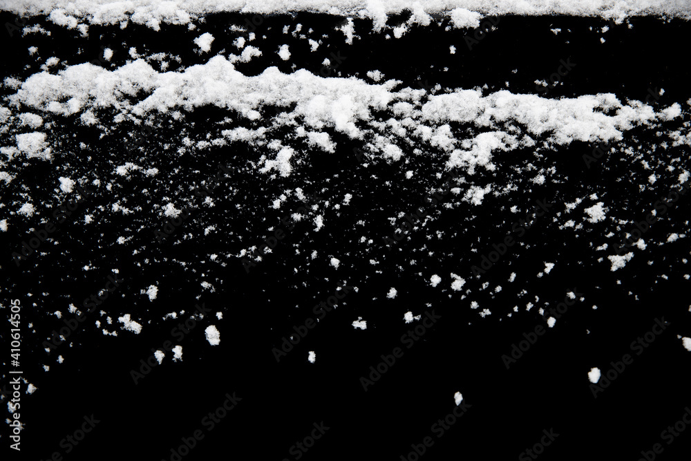 Poster white snow isolated on a black background. winter elements for design