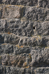 Fototapeta premium Old rough stone wall background. 