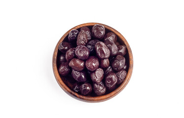 Black olives in wooden bowl on white background