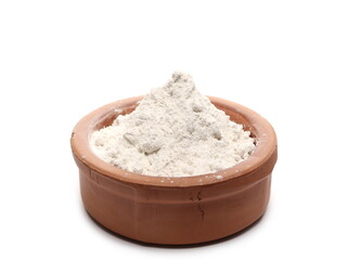Rye flour pile in clay bowl isolated on white background